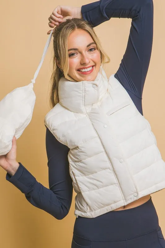 Optimize the title by adding descriptive and appealing modifiers for potential customers:

Stylish Kaelyn High Neck Zip-Up Puffer Vest with Convenient Storage Pouch