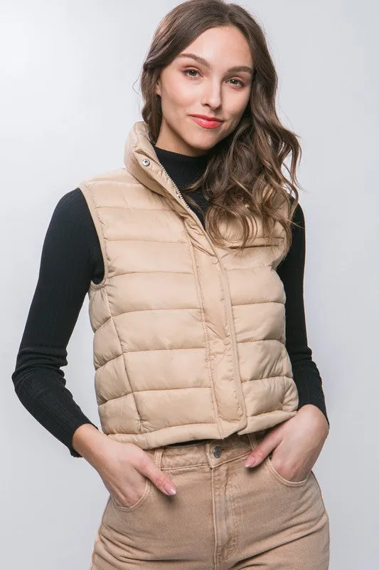 Optimize the title by adding descriptive and appealing modifiers for potential customers:

Stylish Kaelyn High Neck Zip-Up Puffer Vest with Convenient Storage Pouch